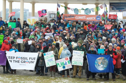 Crowd marching at Denver Global Climate March