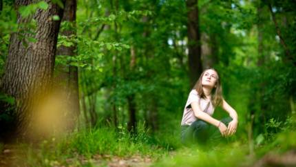 picture of young girl in the woods
