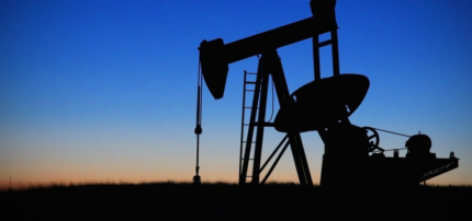 image of an oil well at twilight